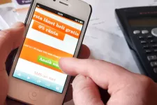 Mobile phone showing website offering quick loans