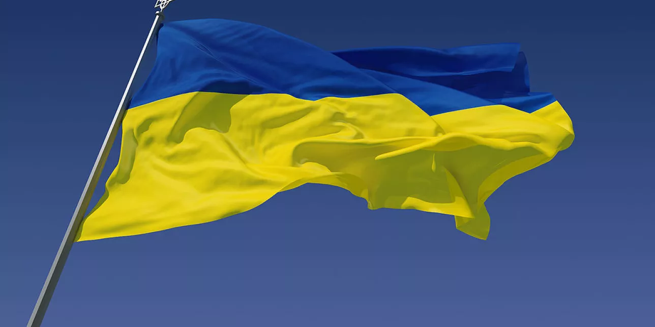 The flag of Ukraine against a blue sky. Photo.