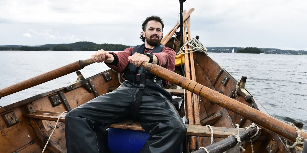 Greer Jarrett rowing a boat at sea
