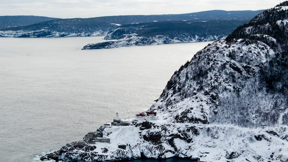 Snowy coastline and the sea 