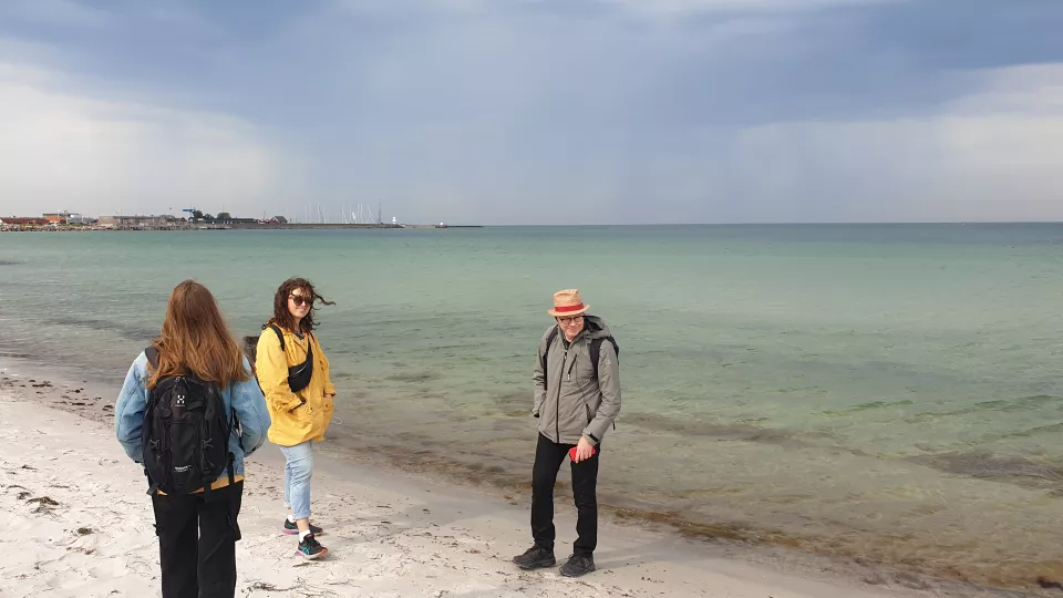 Three people on the beach in Falsterbo