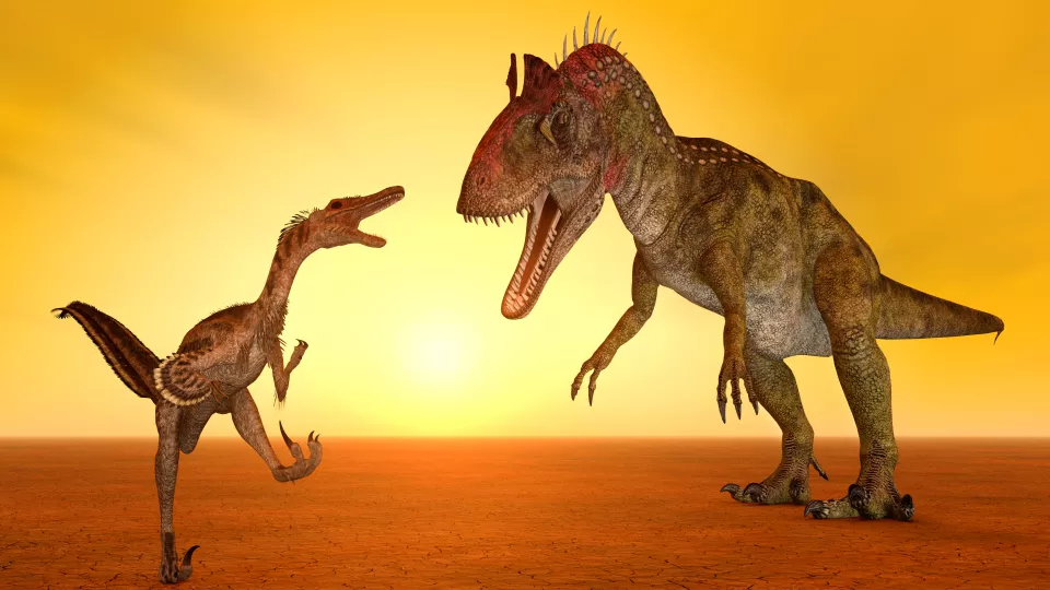 Two dinosaurs at sunset