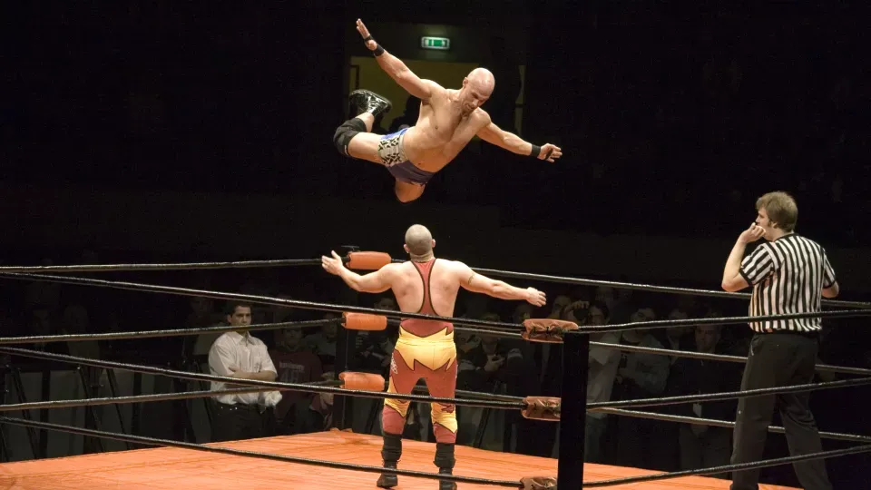 Two WWE wrestlers in a wrestling ring