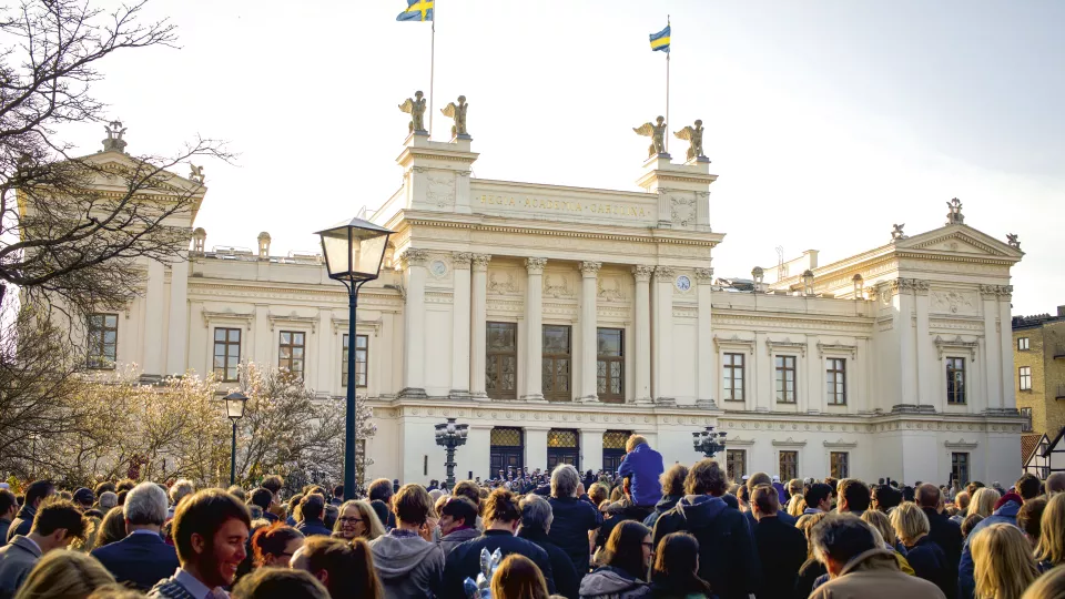 Main university building on May 1st with audience in front
