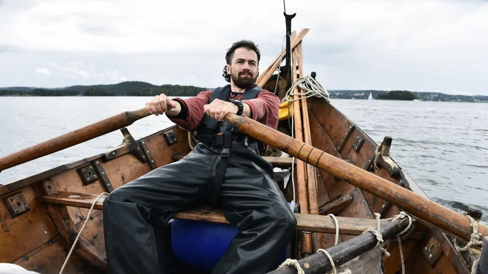 Greer Jarrett rowing a boat at sea