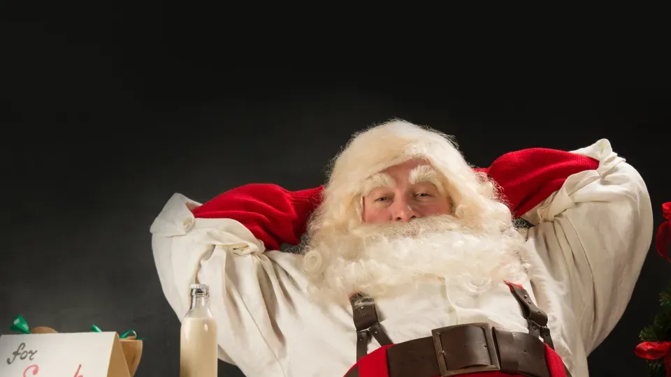 Santa Claus sitting and leaning back