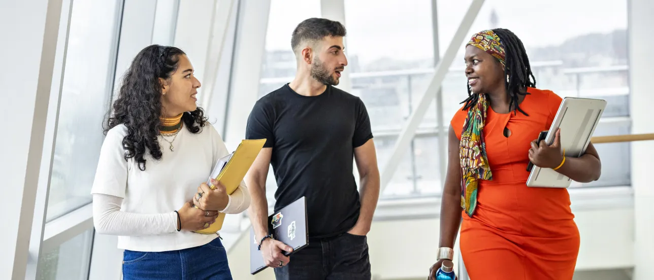 Three student talking to each other.
