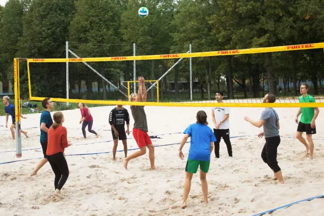 Students playing beach volleyball at one of the nations