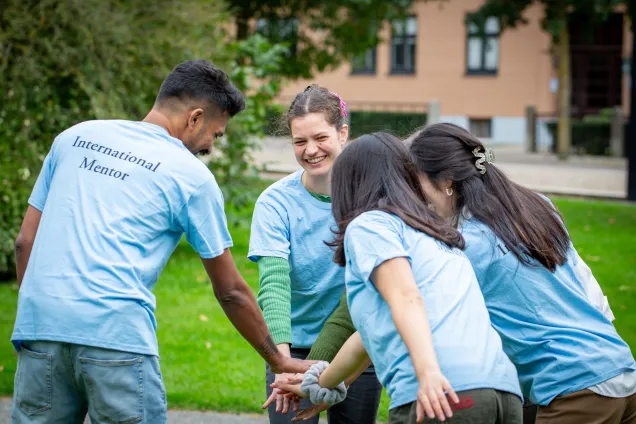 Happy international mentors in a group. Photo.