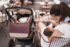 Woman breastfeeding in a cafe