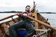 Greer Jarrett rowing a boat at sea