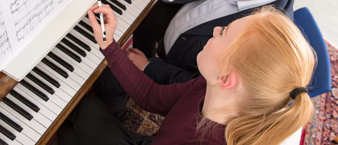 A student playing the piano