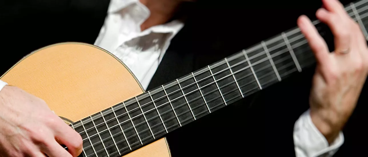 Someone playing a guitar