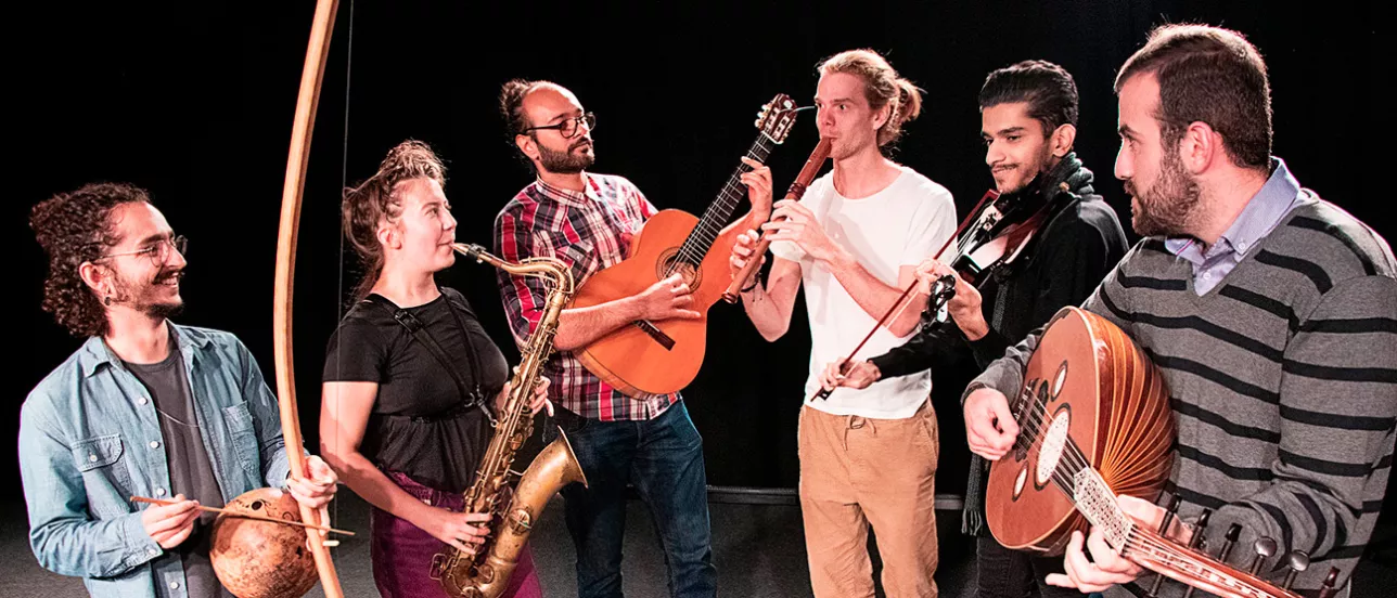 A group of students playing different instruments together