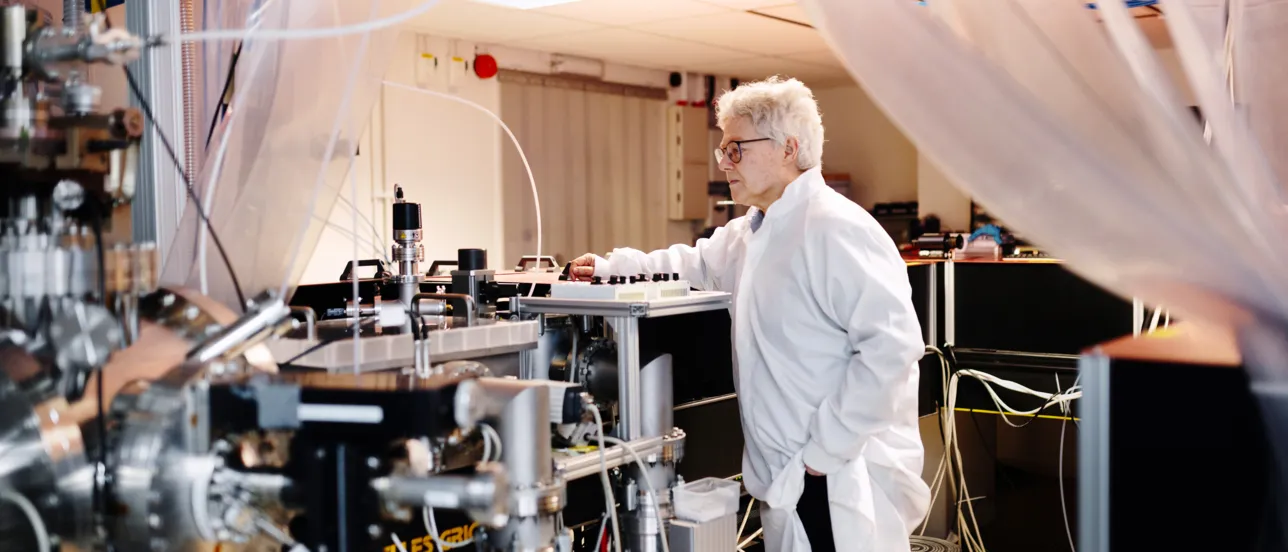 Nobel laureate Anne L'Huillier at a machine.