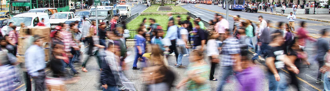People crosses the street in Santiago, Chile. Photo: Mauro Mora/Unsplash.