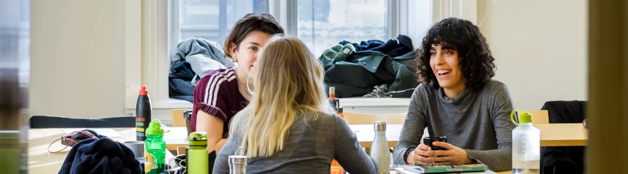 Students laughing in a classroom at Lund University Centre for Sustainability Studies. Photo: Kennet Ruona.