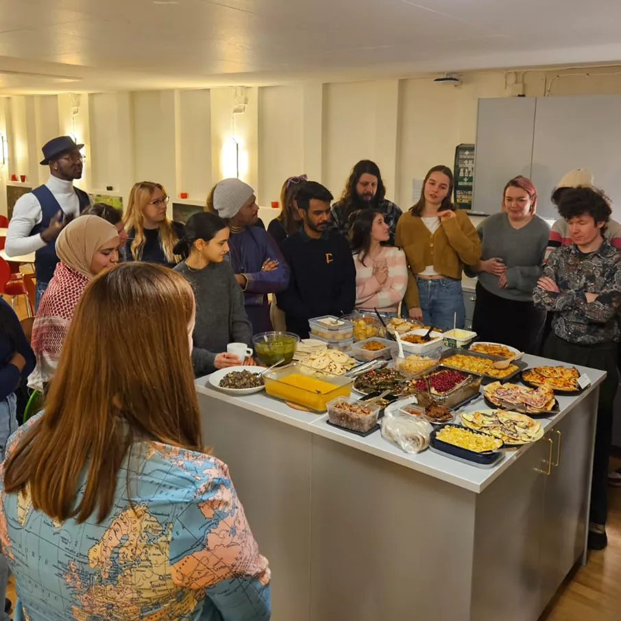 An ambassador potluck dinner in the lounge at the International Office. Photo.