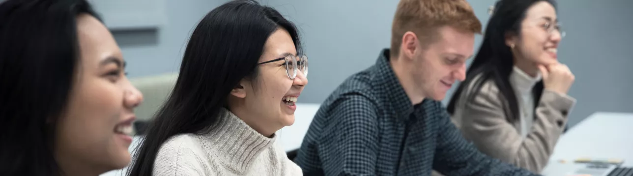 A group of students laugh in an Asian Studies class. Photo: Johan Bävman.