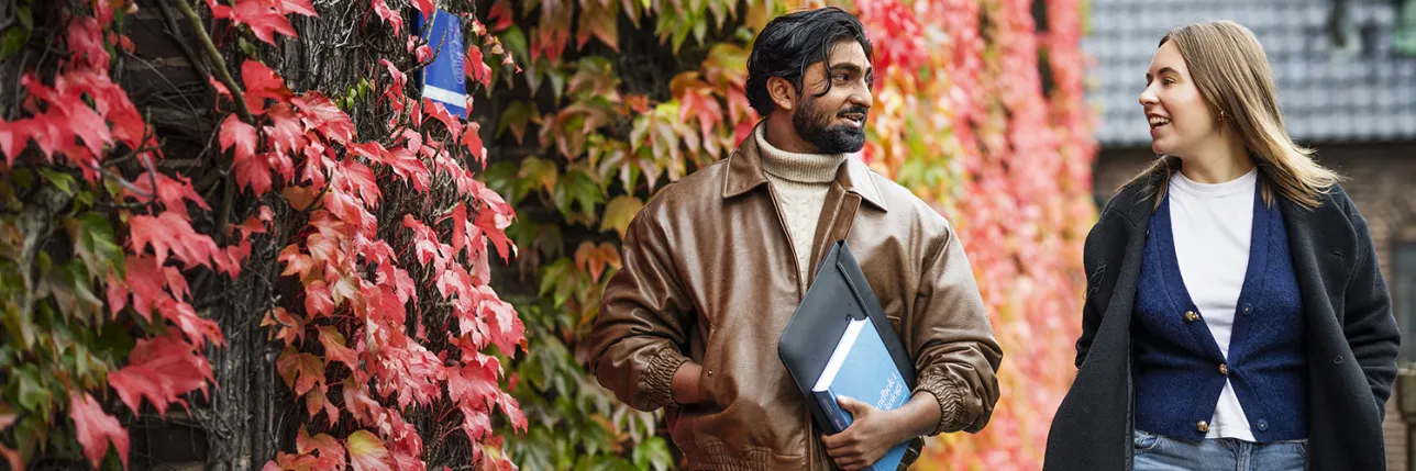 Students walking in an autumn setting. Photo: Johan Persson.