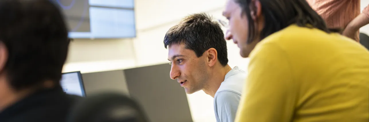 Staff looking at screens. Photo: Johan Persson. 