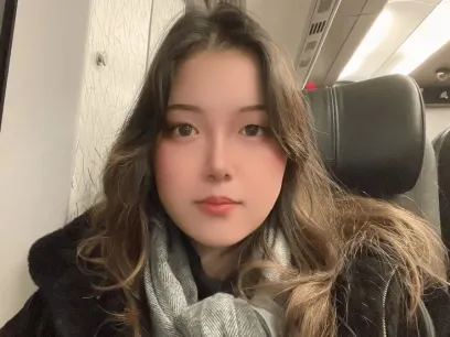 Student Sasiya sitting in a train