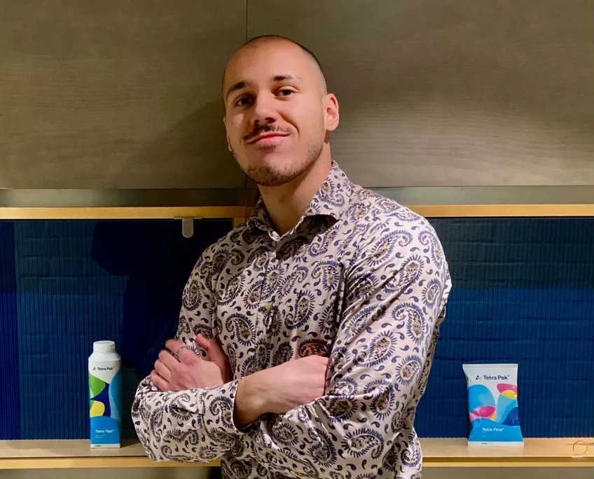 Faruk with some Tetra Pak products in the background. Photo.