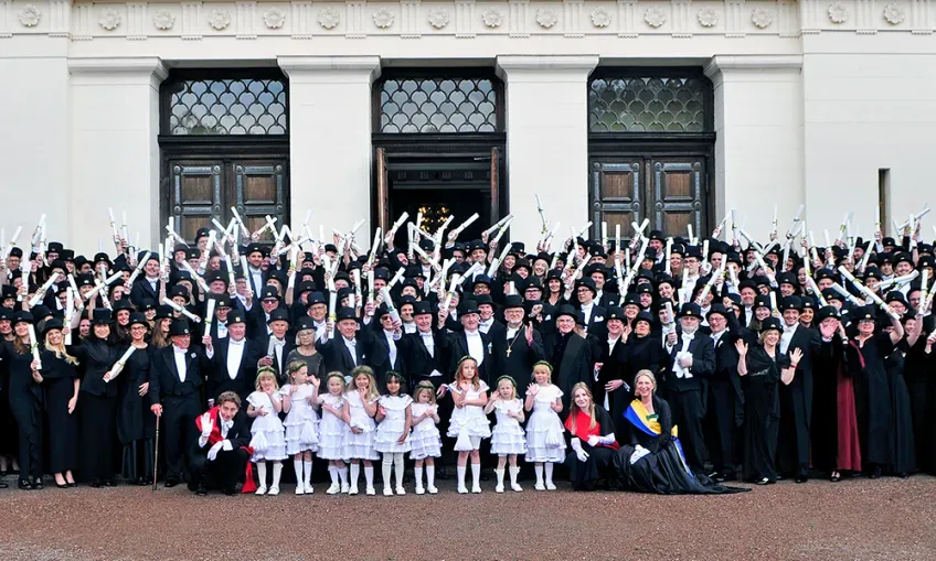New doctors standing in front of the Main University Building. Photo. 
