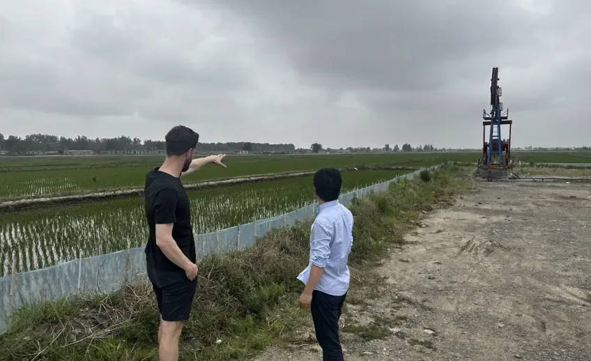 The two researchers by the river